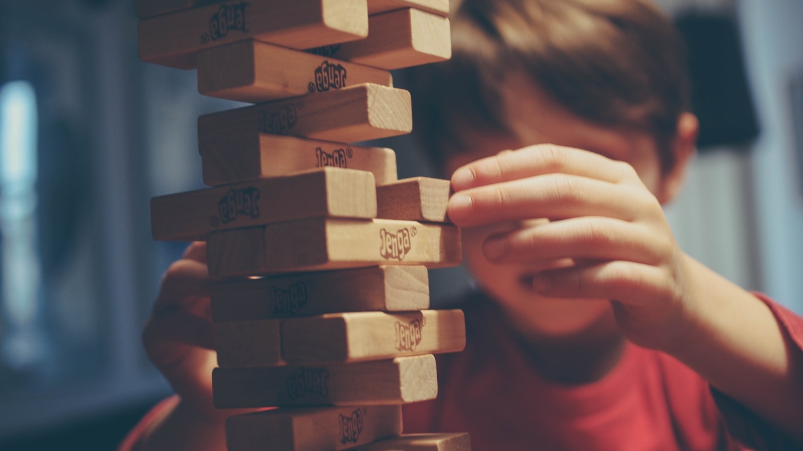 Boy playing jenga